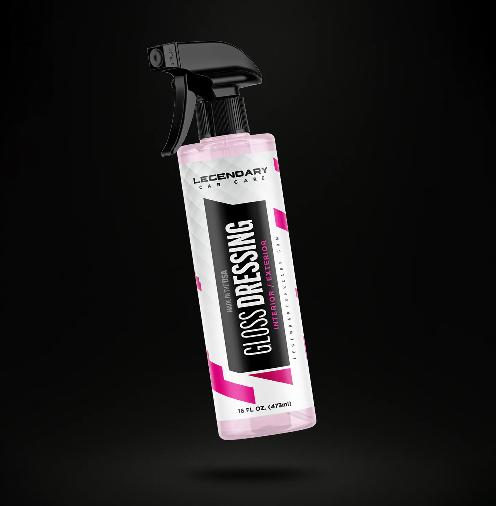 A spray bottle labeled 'Gloss Dressing,' for car care, on a black background.