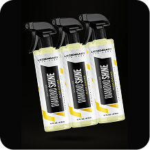 Three spray bottles of Legendary Car Care Diamond Shine glass cleaner against a black background.