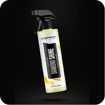 A spray bottle of Legendary Car Care Diamond Shine Glass Cleaner on a black background.