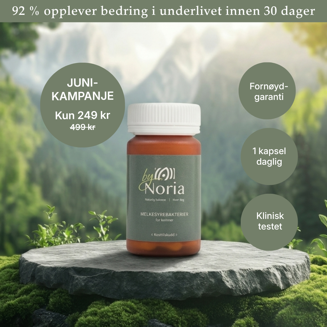 A bottle of by Noria supplements sits on a mossy stone in front of a mountain landscape.