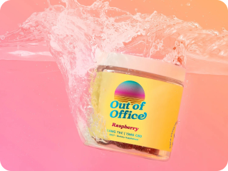 Jar labeled 'Out of Office' splashing in water against a pink-orange gradient background.