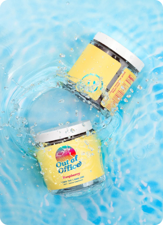 Two jars with yellow labels splashing in water.