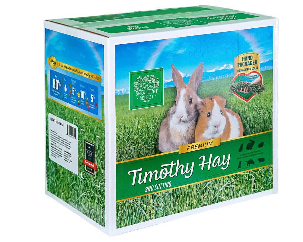 A box of Small Pet Select Timothy Hay with a rabbit and a guinea pig on the front.