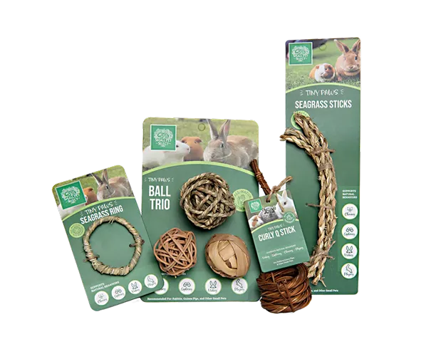 A collection of Tiny Paws brand natural fiber chew toys for small pets like rabbits and guinea pigs.