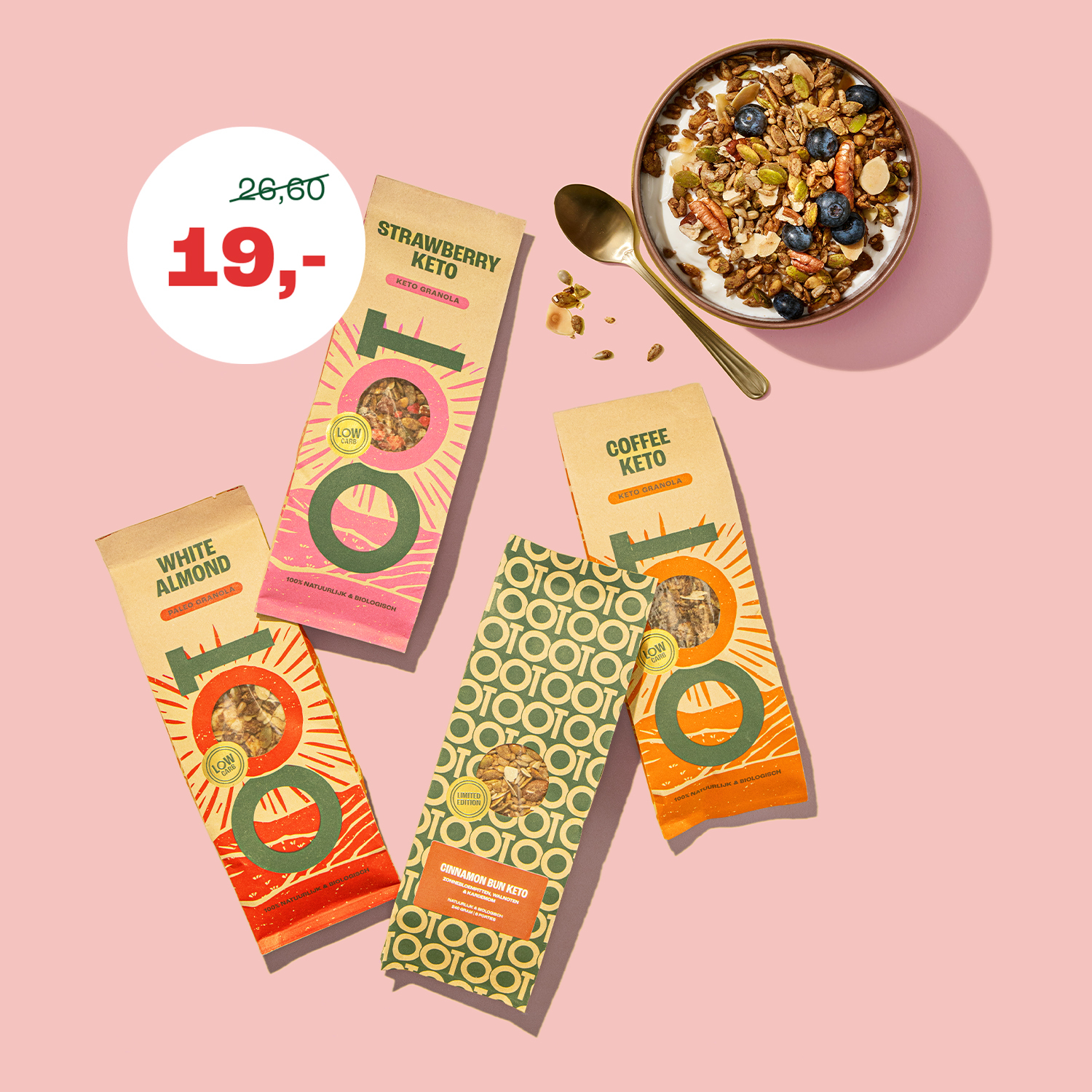 An overhead shot of four bags of OOT brand granola next to a bowl of granola with blueberries.