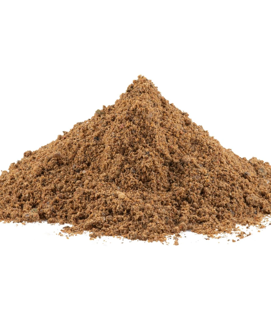 A pile of brown, coarse ground spice on a white background.