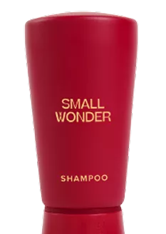 Red shampoo bottle labeled 'Small Wonder'.
