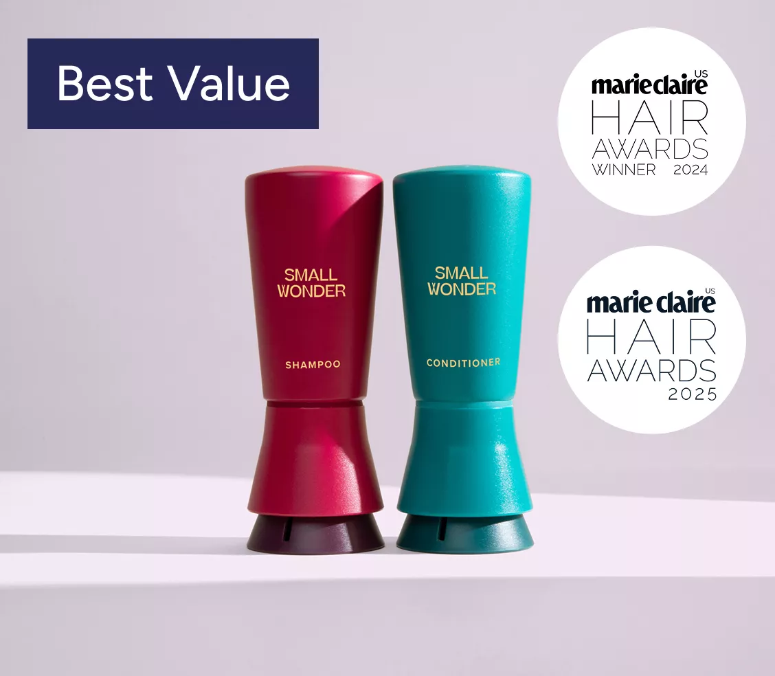 Two bottles of Small Wonder shampoo and conditioner with award badges.