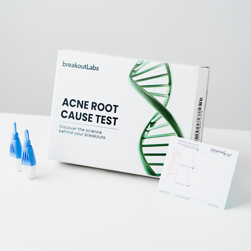 The breakoutLabs Acne Root Cause Test kit, including its box, two lancets, and a blood sample card.