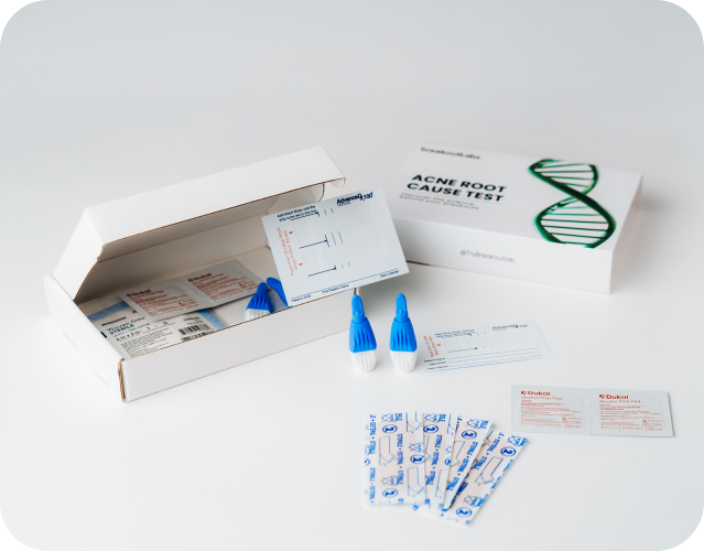 An at-home 'Acne Root Cause Test' kit is displayed with its contents on a white background.