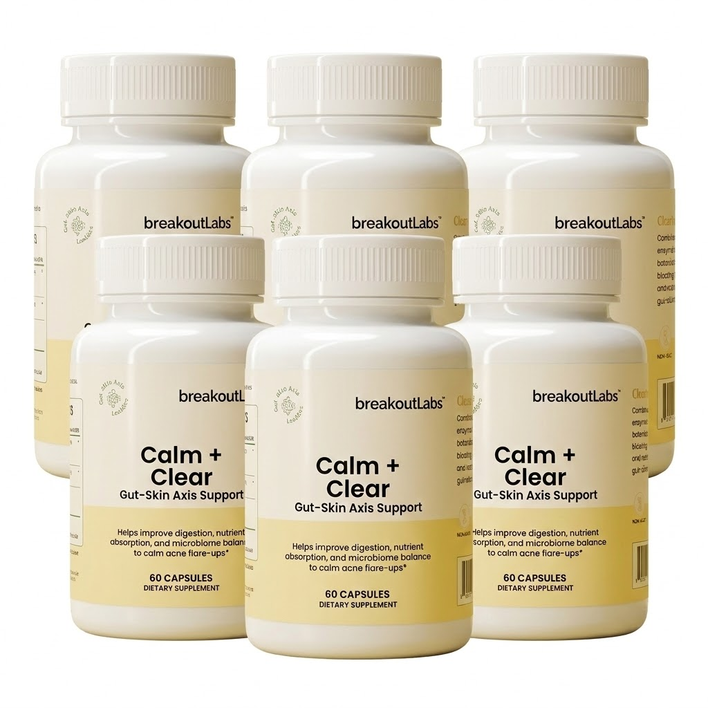 Six white bottles of breakoutLabs Calm + Clear dietary supplement against a plain white background.