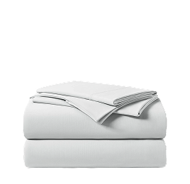 A neatly folded stack of white bed sheets against a white background.