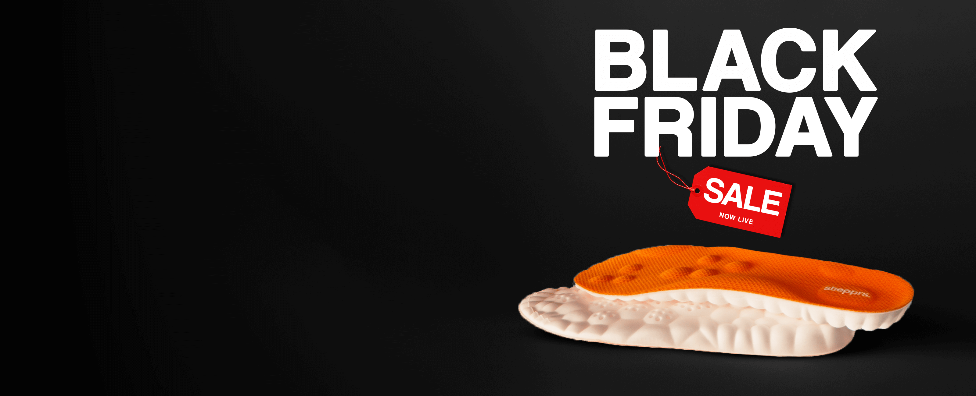 Black Friday sale text with orange and white shoe insoles on black background.