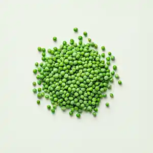A pile of green peas on a light background.