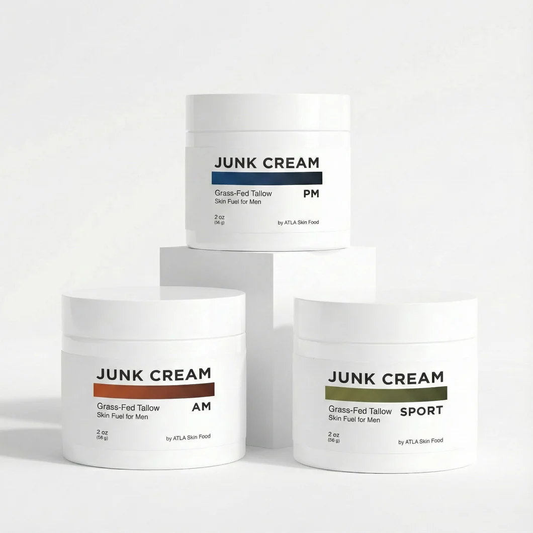 Three white jars of Junk Cream for men, for AM, PM, and Sport, arranged on white blocks.