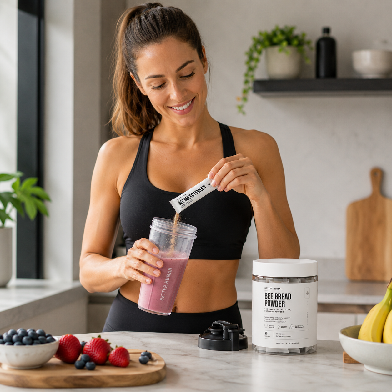 A smiling woman in workout clothes pours a packet of Bee Bread Powder into a smoothie shaker.