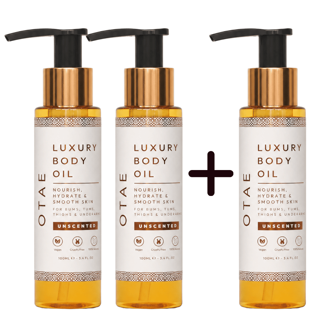 Three bottles of OTAE Luxury Body Oil arranged in a 'two plus one' format against a white background.