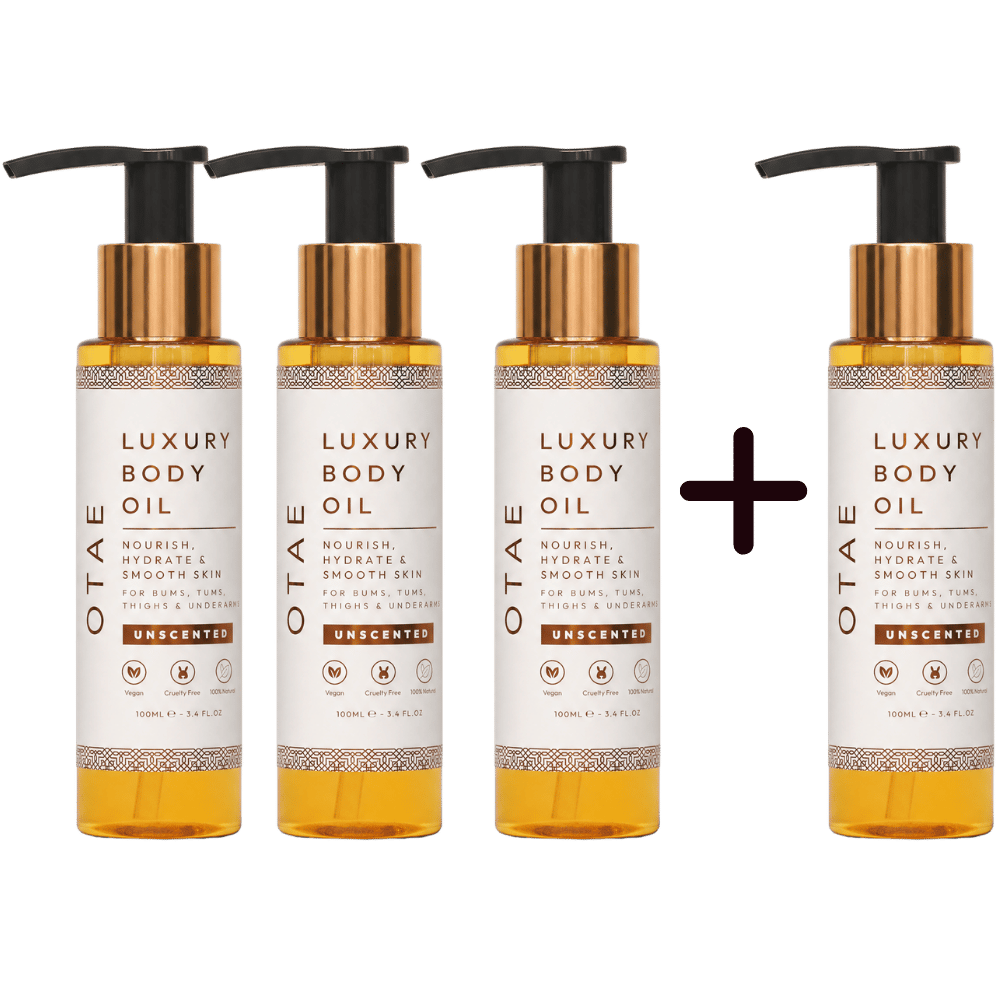 Four bottles of OTAE Luxury Body Oil arranged as three plus one on a white background.