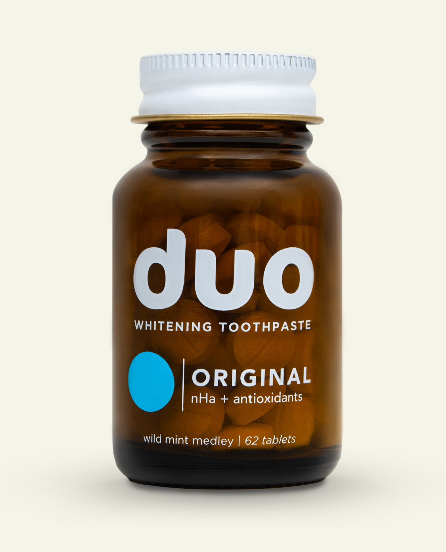 Brown bottle labeled 'duo whitening toothpaste' with 62 tablets inside.