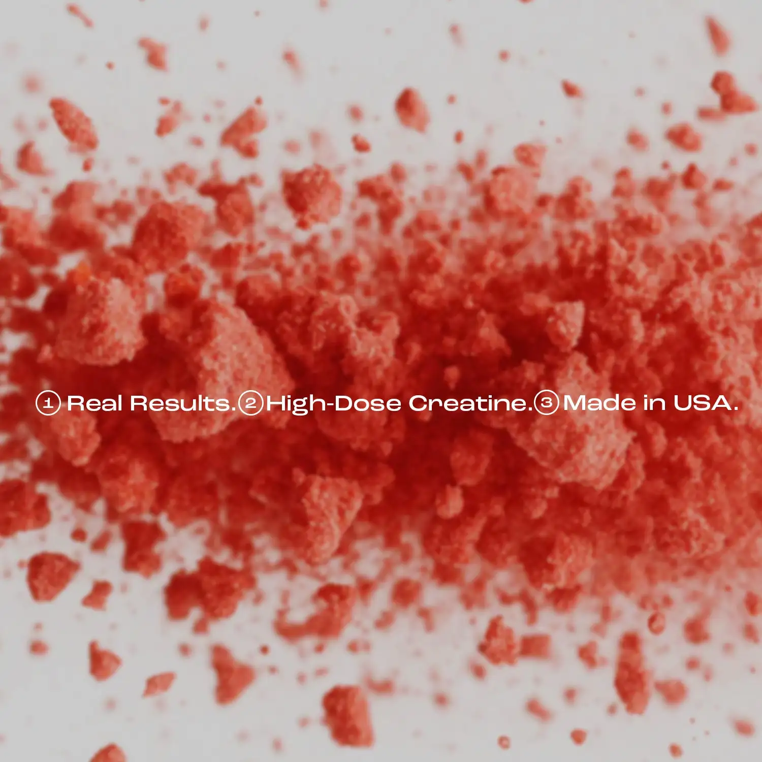 Red powder scattered on a white surface with text overlay.