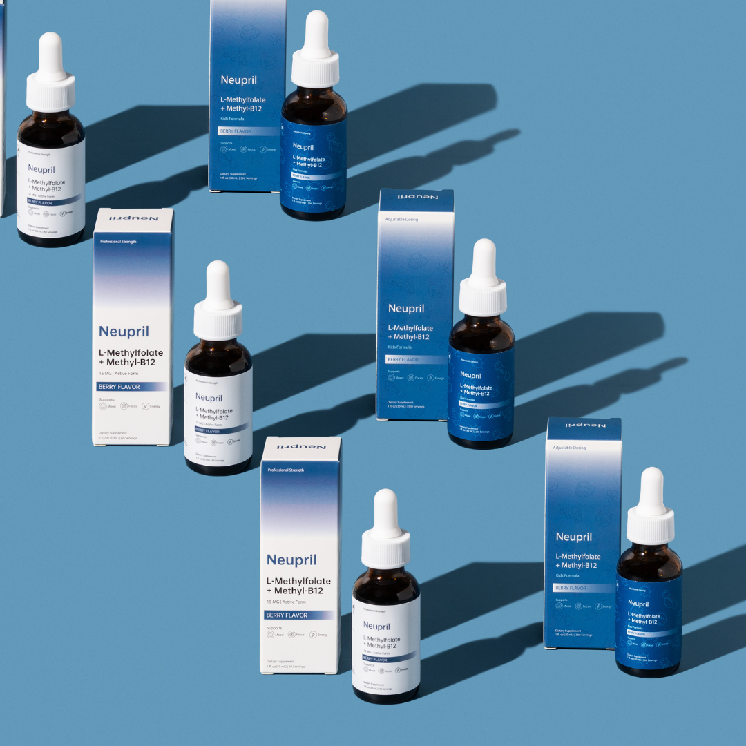 Multiple Neupril L-Methylfolate and Methyl-B12 supplement bottles and boxes arranged on a blue background with scattered fresh berries