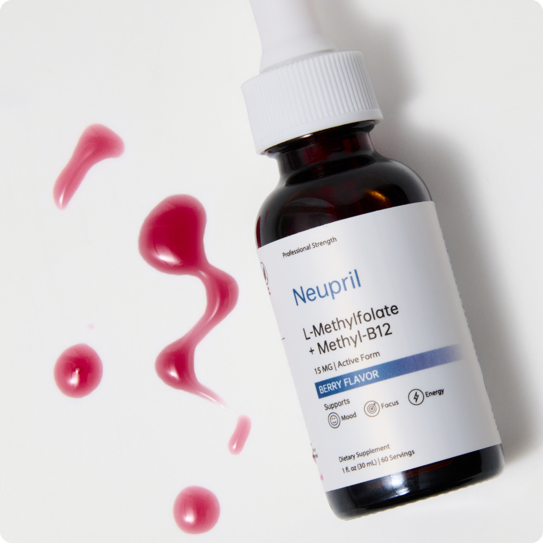 'Neupril L-Methylfolate + Methyl-B12 berry-flavored liquid supplement in amber dropper bottle with pink liquid drops splashed beside it on white background.'