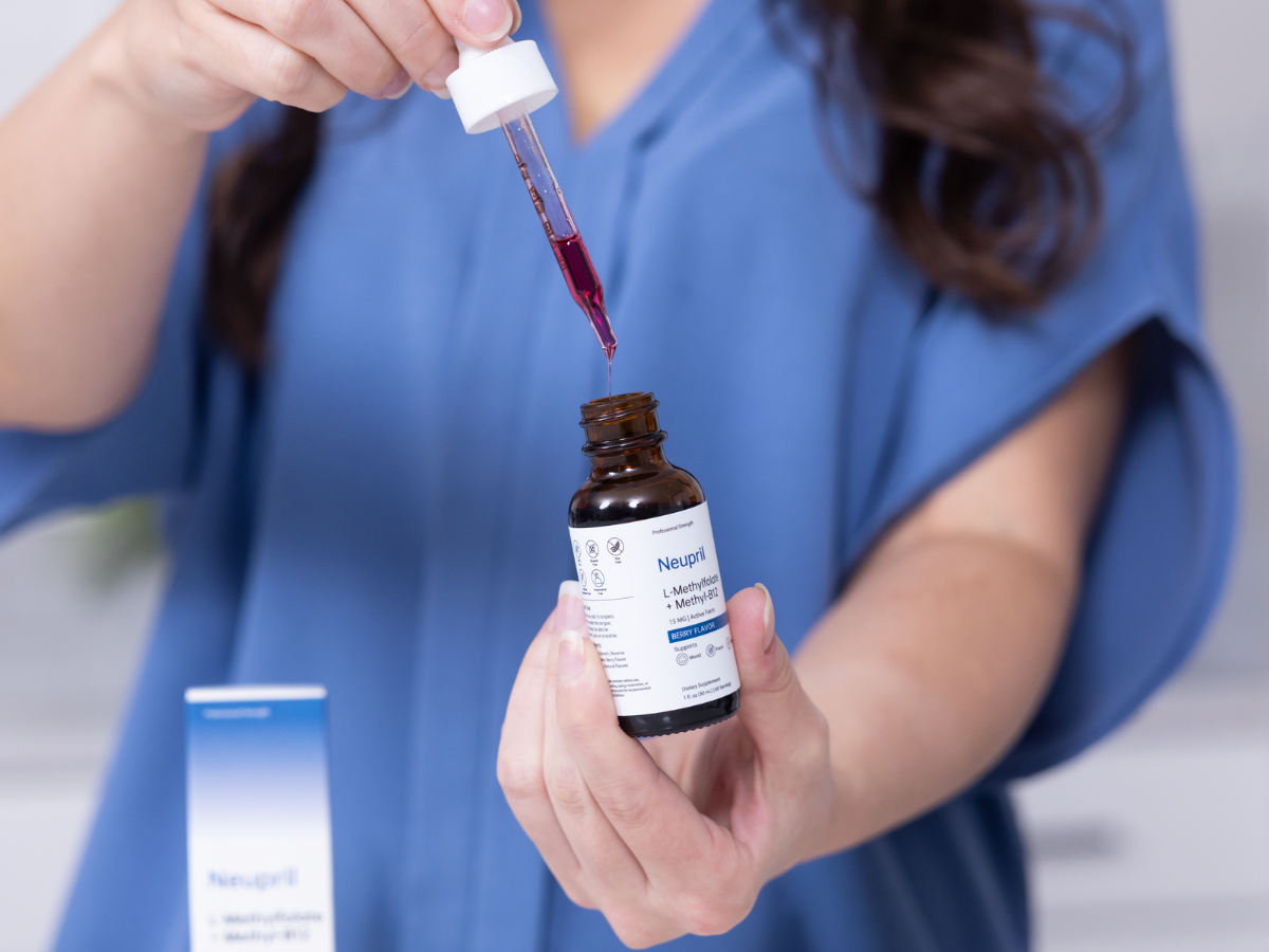 Healthcare worker preparing a dose of Neupril L-Methylfolate + Methyl-B12 for daily focus support.