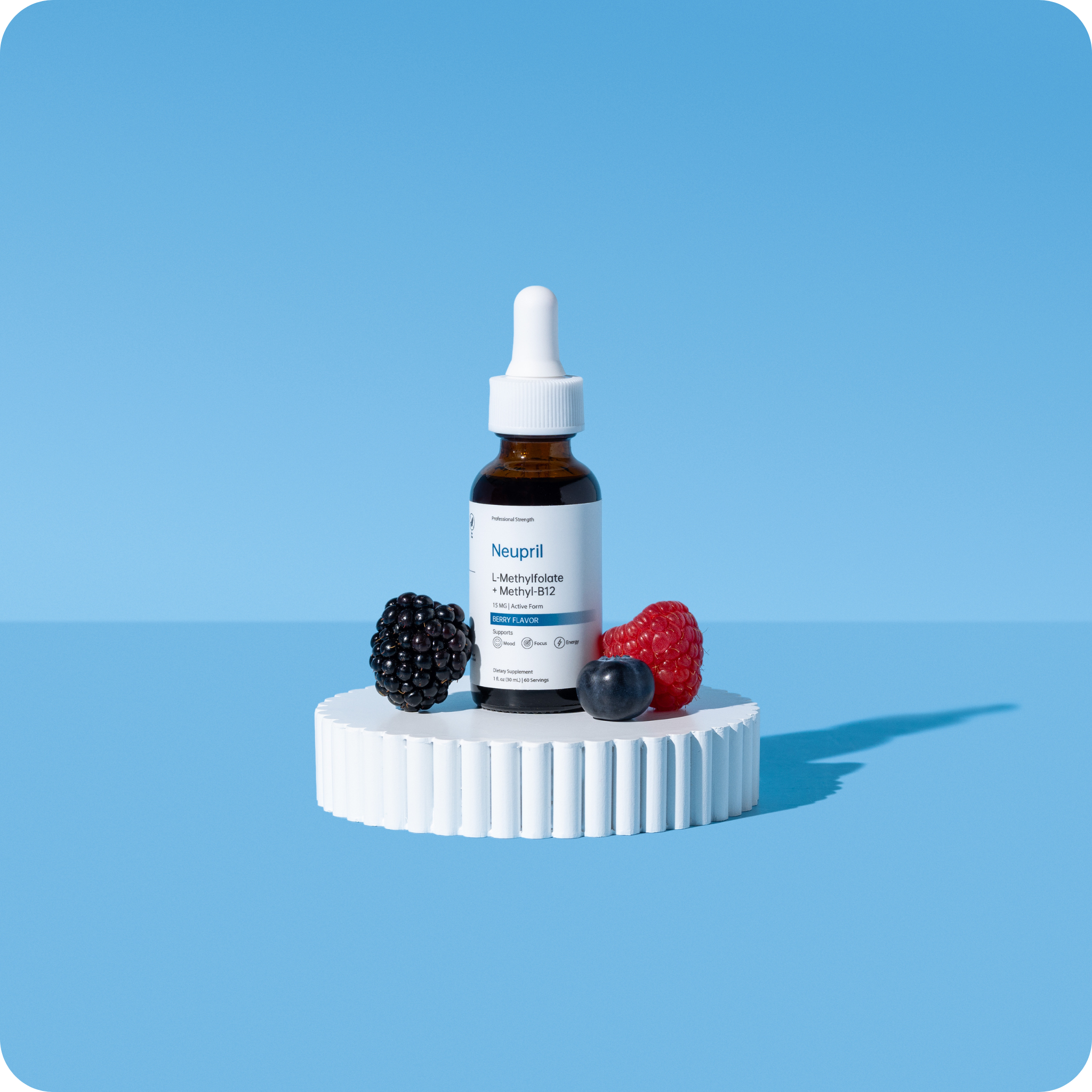 Dropper bottle with berries on a white platform against a blue background.