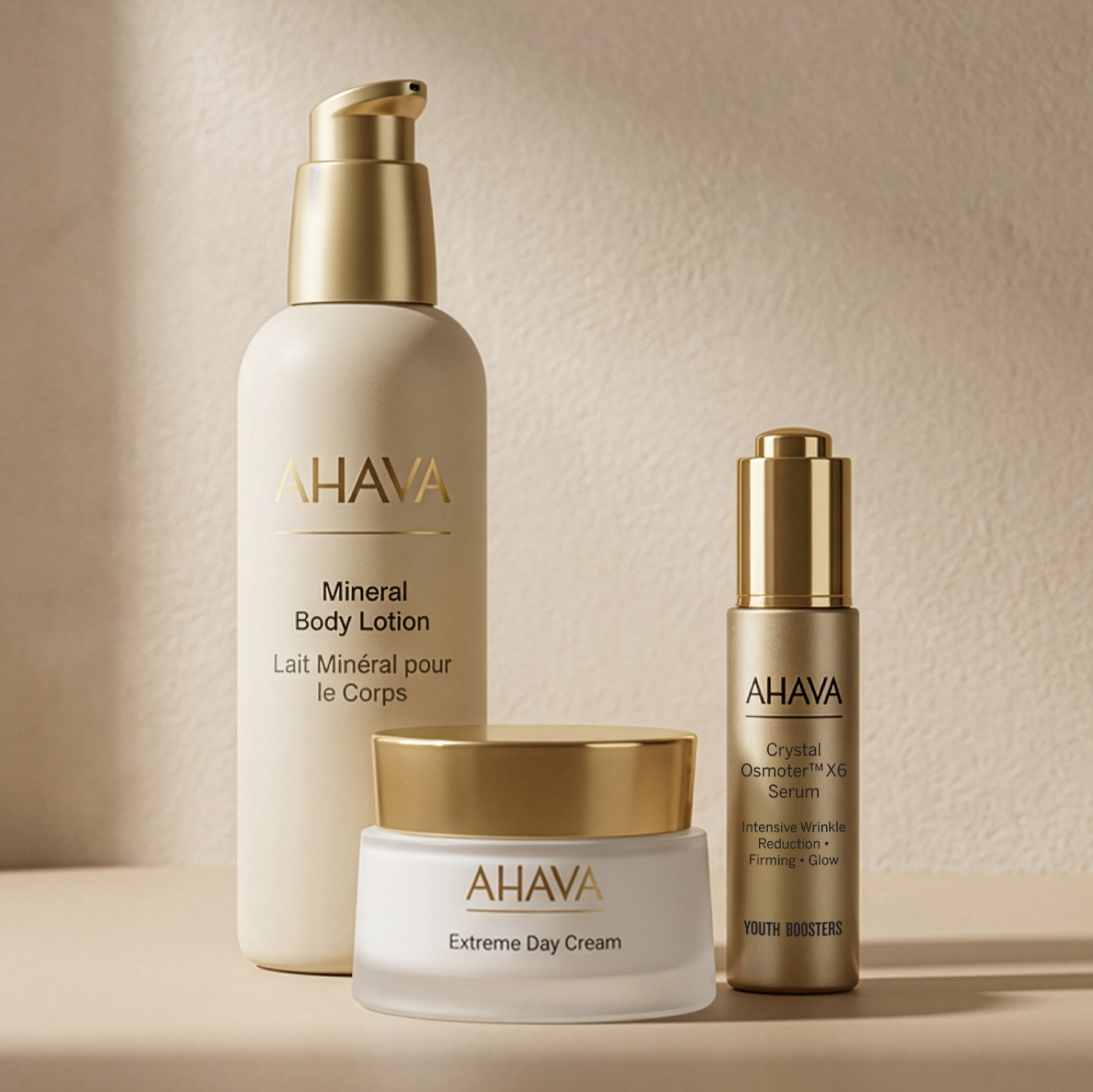 A collection of three AHAVA skincare products, including a lotion, a serum, and a day cream.