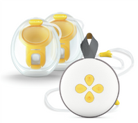 Breast pump with two yellow and white components and a circular control unit.