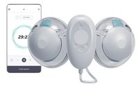 Electronic device with two round components and a smartphone displaying an app interface.