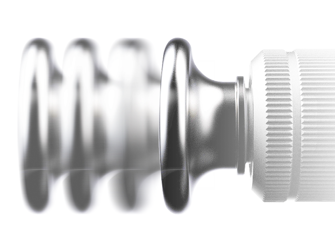 Close-up of a metallic component with detailed grooves and ridges.