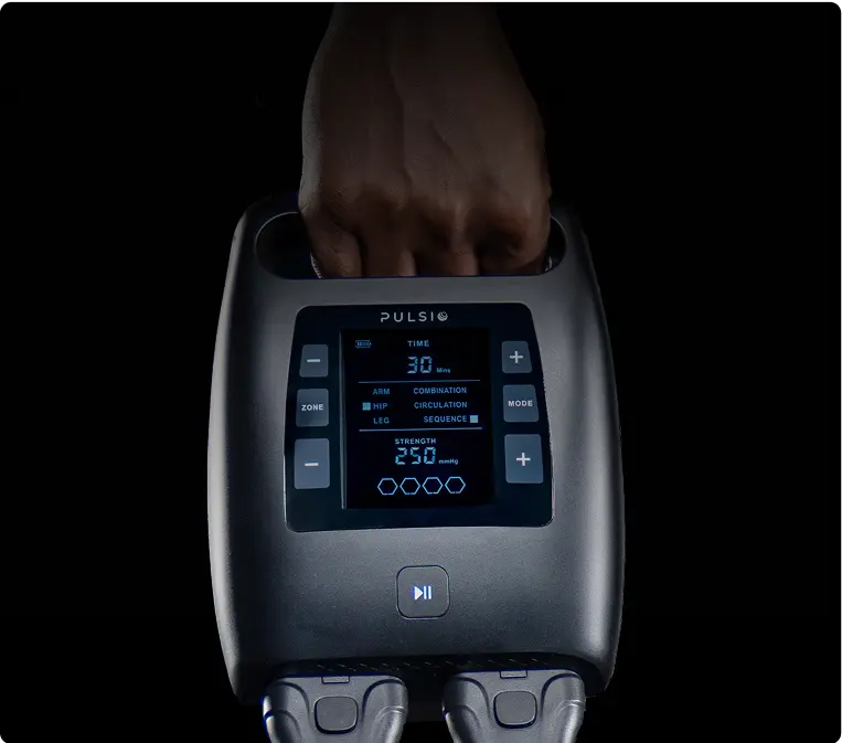 A hand holding a device with a digital display and buttons.