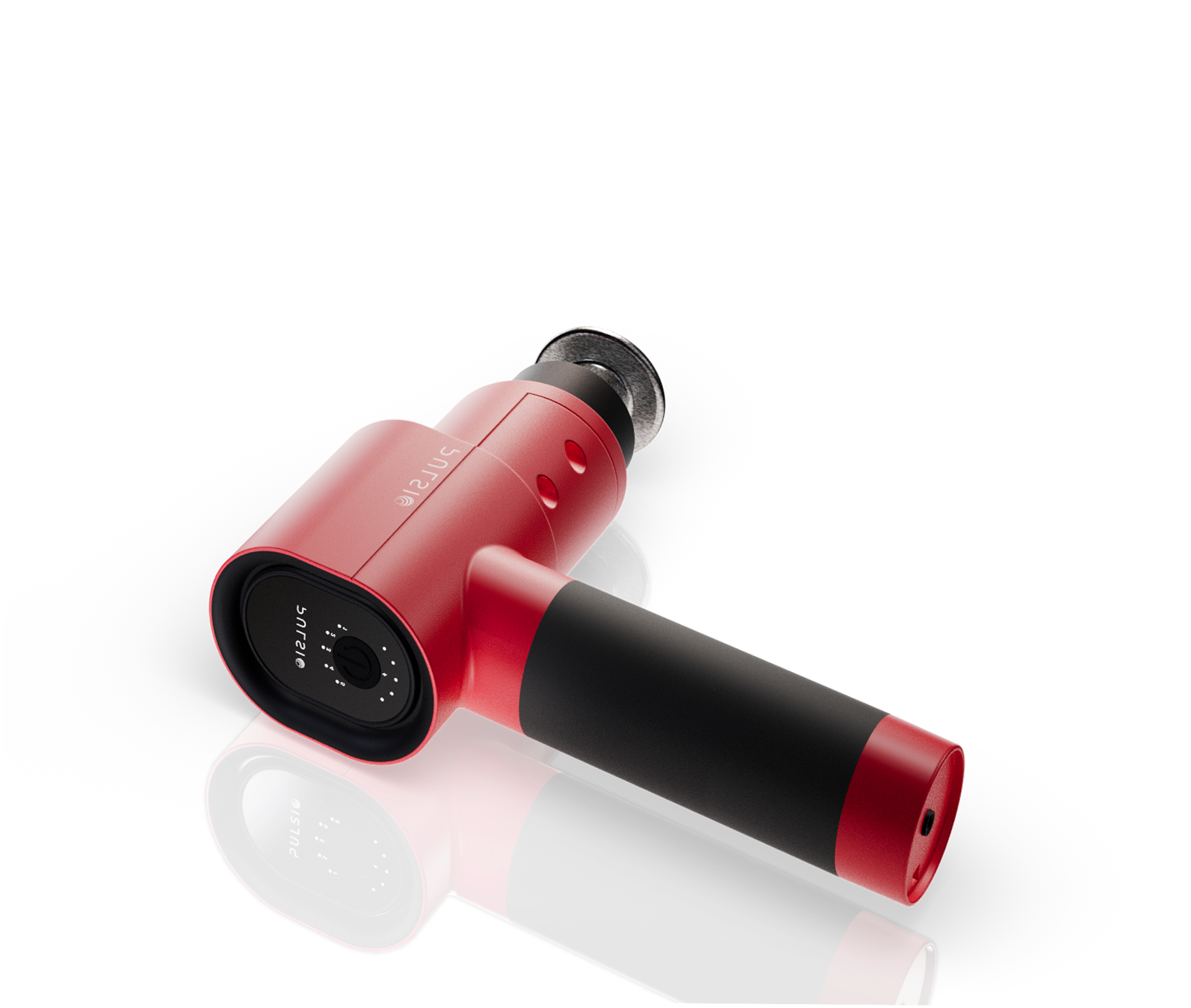 A red and black handheld massage gun with a flat head attachment, on a white reflective surface.