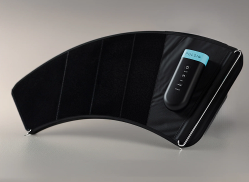 A curved black fitness device with a blue label and control buttons.