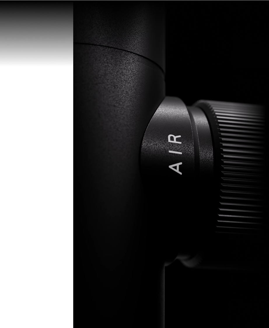 Close-up of a black cylindrical object with 'AIR' text and ridged surface.