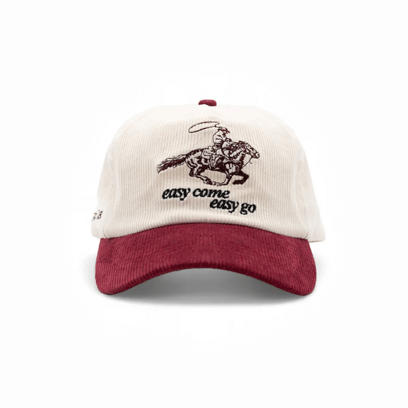 A cream and maroon corduroy baseball cap with an embroidered cowboy and the words 'easy come easy go'.