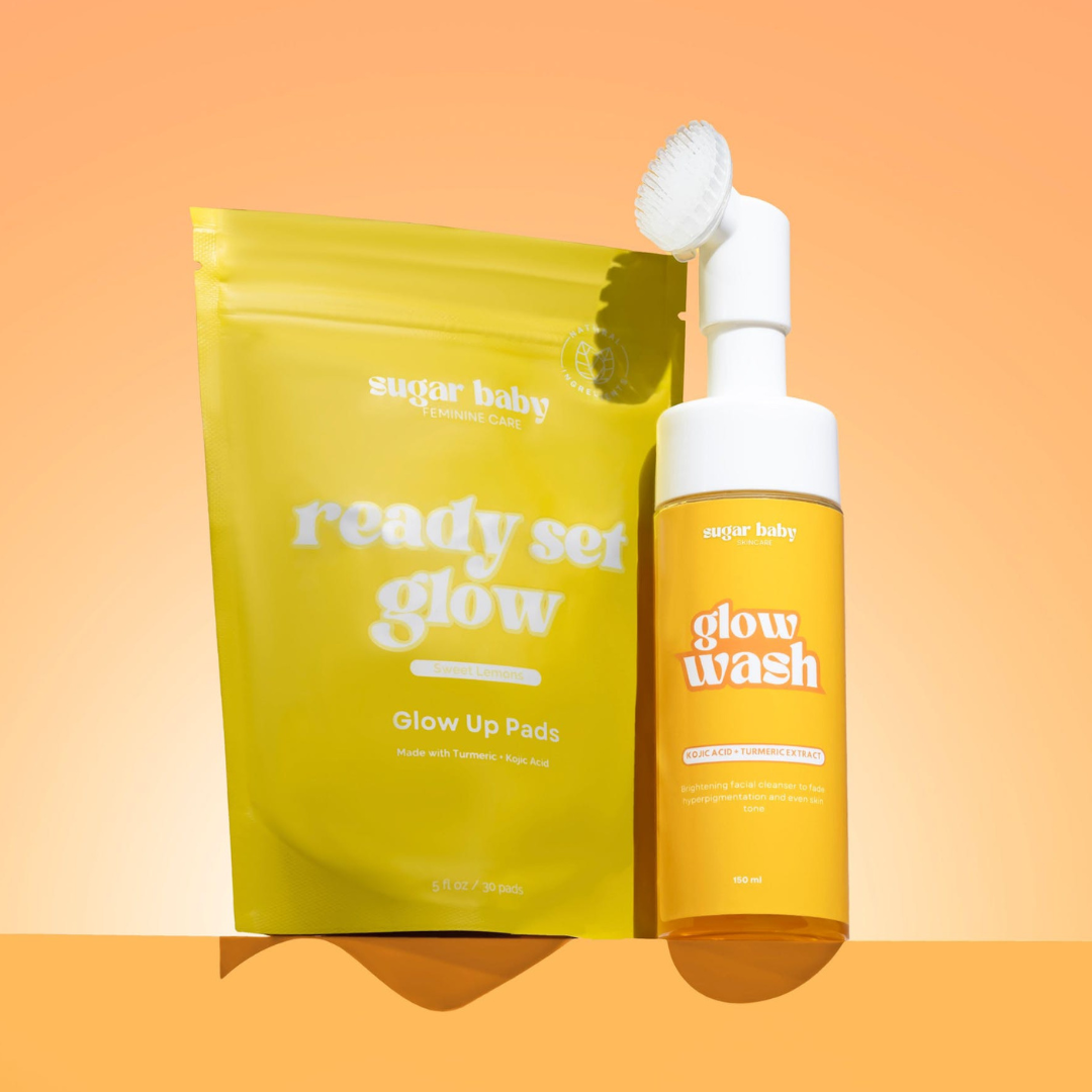 Yellow packaging of skincare products labeled 'ready set glow' and 'glow wash' on orange background.