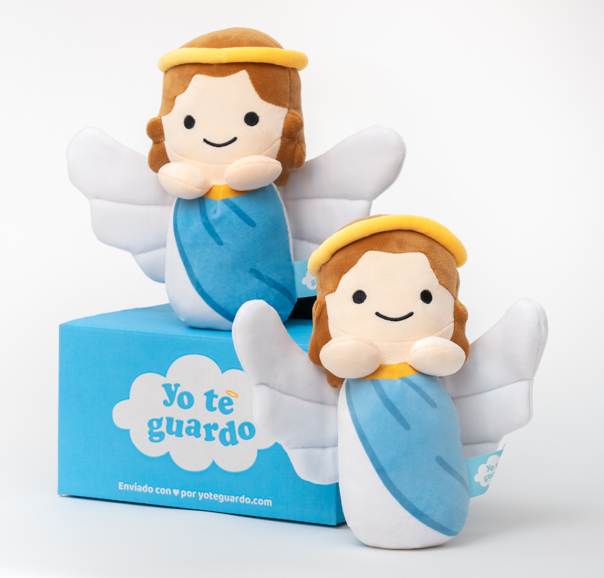 Two cute, smiling plush angel toys are displayed with a blue box against a white background.