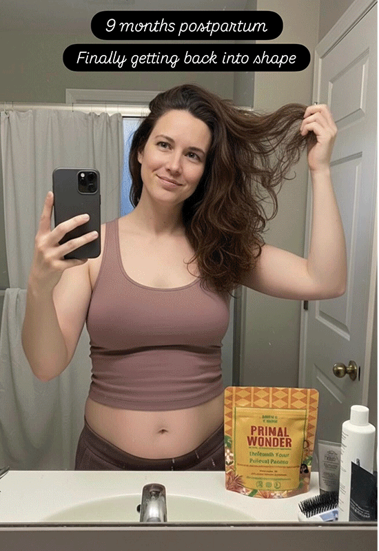 Person taking a mirror selfie, holding hair, with a product pouch on the counter.