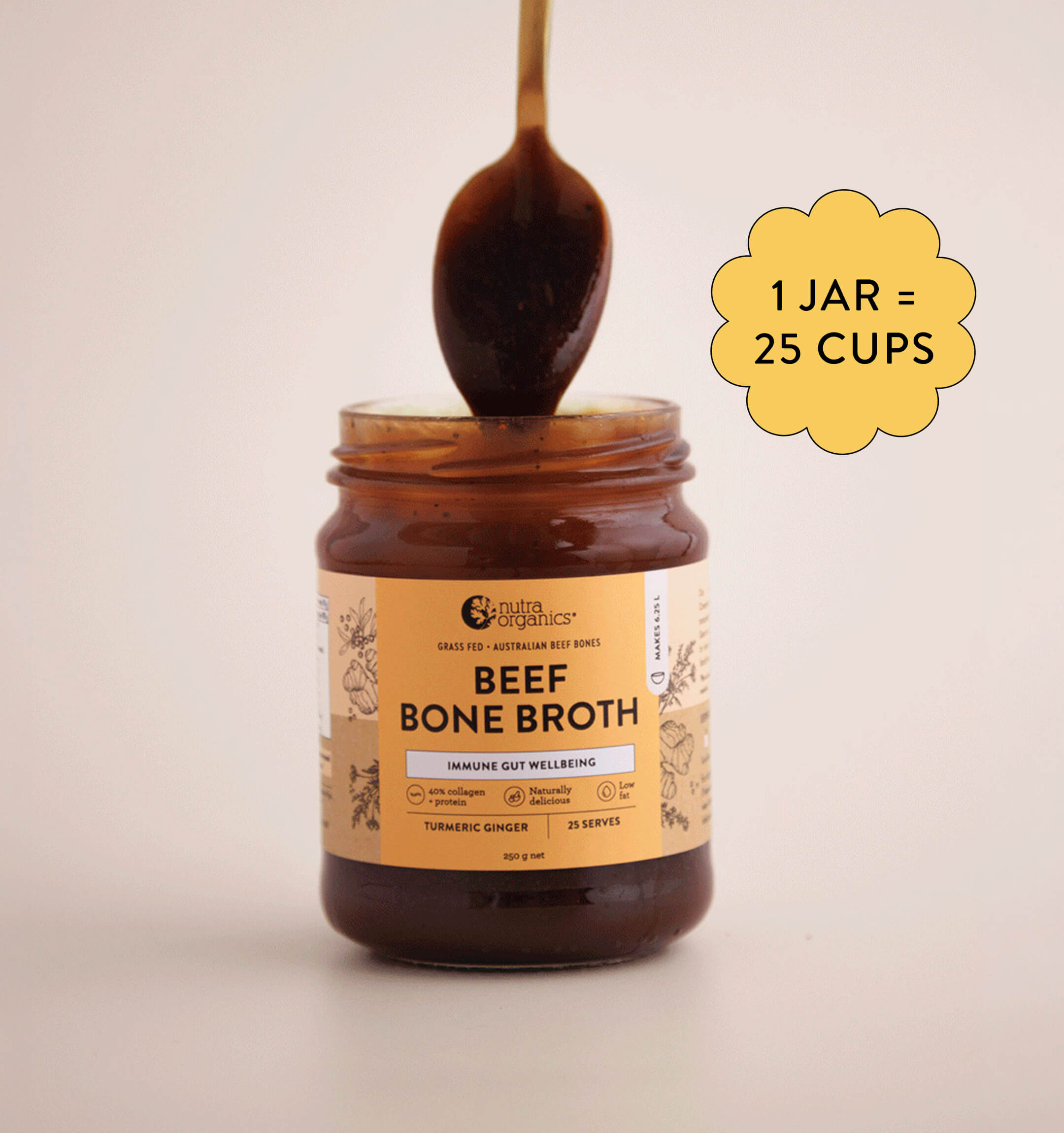 A spoon being dipped into a jar of Nutra Organics Beef Bone Broth concentrate against a plain background.
