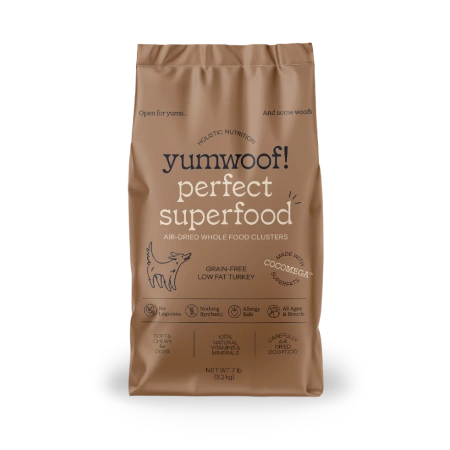 A brown bag of Yumwoof! Perfect Superfood dog food against a solid green background.