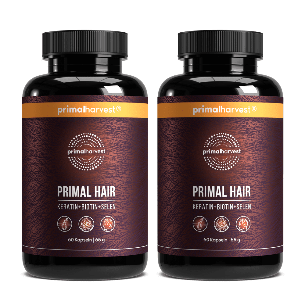 Two bottles of Primal Hair supplement.