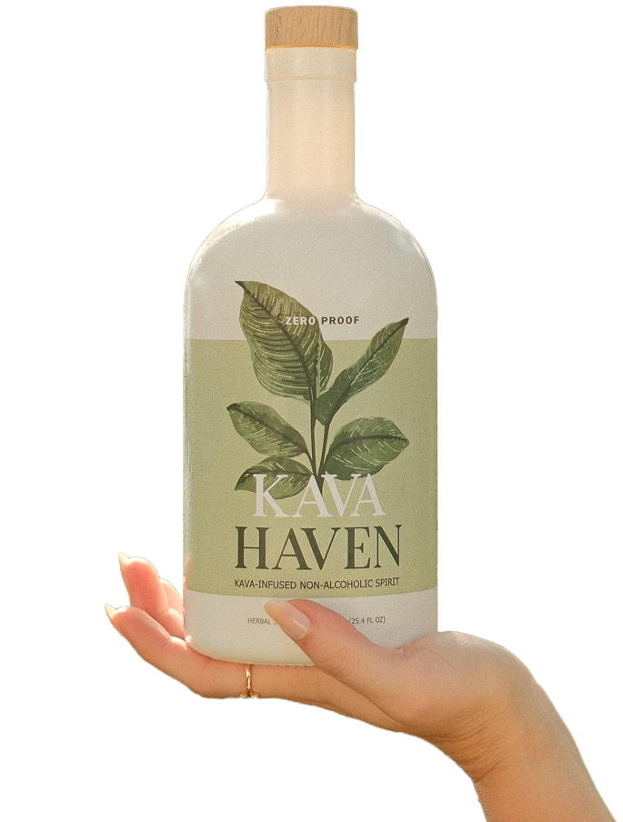 Hand holding Kava Haven non-alcoholic spirit bottle with green label and leaf design.