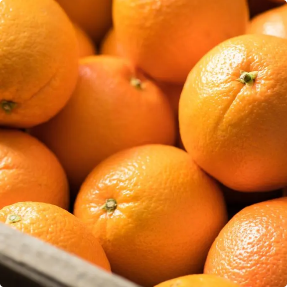 Close-up of a pile of fresh oranges.