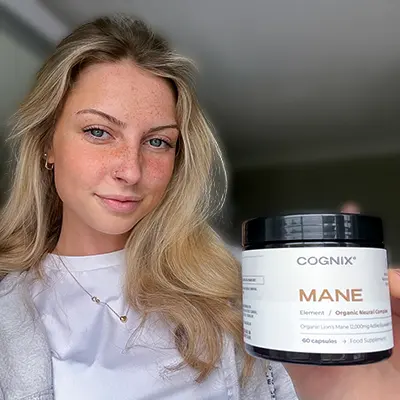 Person holding a jar labeled 'COGNIX MANE' with a neutral expression.