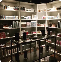 Shelves filled with various bottles and products in a dimly lit store.