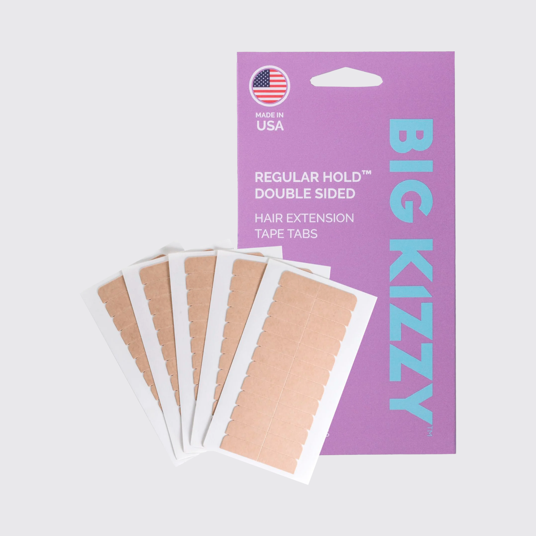 Hair extension tape tabs with packaging labeled 'Big Kizzy' and 'Made in USA.'