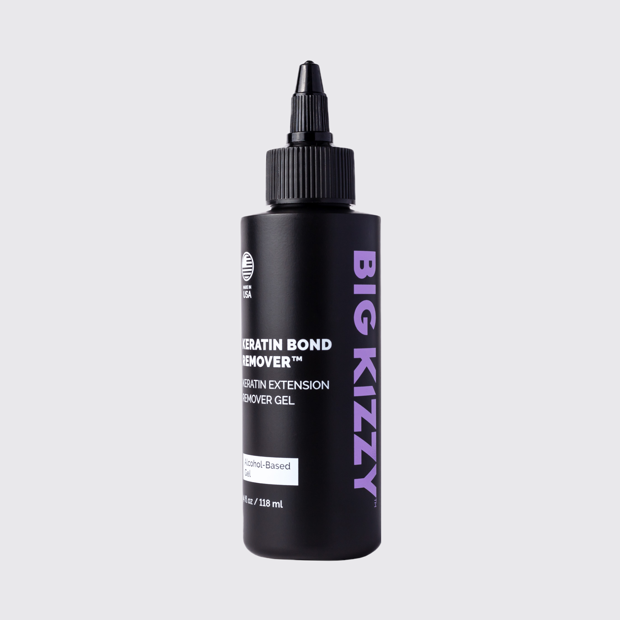 Black bottle of keratin bond remover with purple text on a gray background.
