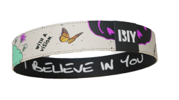 Decorative wristband with butterfly, text, and abstract designs.